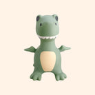 Green dinosaur-shaped toy on a white background