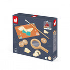 Box of a children's toy set with magnifying glass, sticks, and other items on a white background