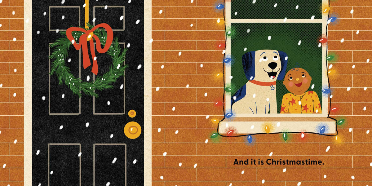 An interior spread from Dog's First Christmas showing a black front door adorned with a festive green wreath and a red bow on the left, next to a red brick wall with a window on the right. A white dog and a smaller dog look out through the window, surrounded by string lights, with text at the bottom that reads, "And it is Christmastime."