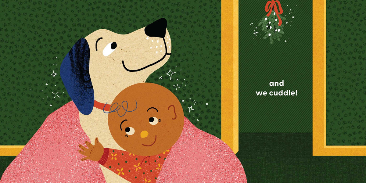 An interior spread from Dog's First Christmas featuring a white dog wearing a pink blanket and cuddling a smiling baby in a pink sleeper, against a dark green background with a doorway and mistletoe. Text near the center reads, "...and we cuddle!"