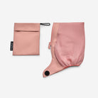 Pink pouch with a zipper and black tag on a white background