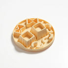 Round cookie cutter with various geometric shapes on a white background