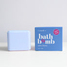 A light blue scrub bar next to its blue packaging box on a white surface against a light gray background. The box is labeled 'bath bomb' and 'astro berry' with a pink 'Super Fresh' badge.