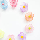 Colorful flower-shaped candies on a white background