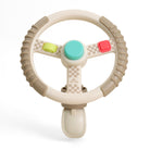 Toy steering wheel with colorful buttons on a white background
