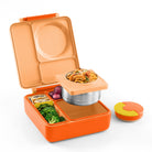 Orange bento box with compartments containing food on a white background