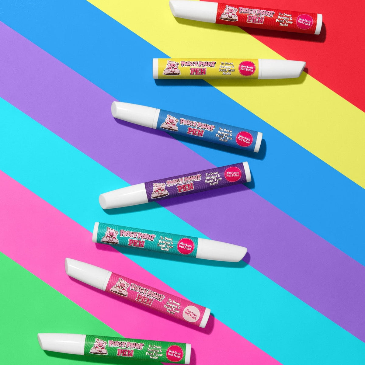 Colorful markers on a multicolored striped background