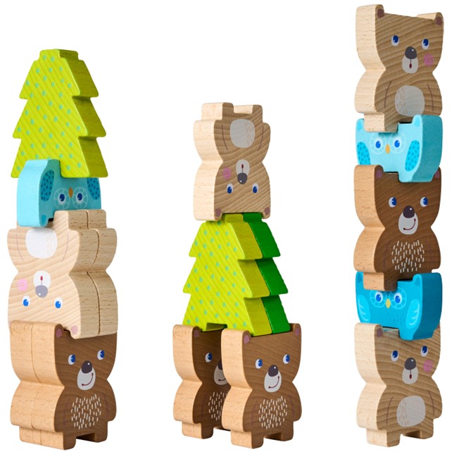 Wooden toy set with bear and tree shapes on a white background
