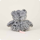 The back view of a gray and white fluffy Opossum by Warmies stuffed animal, showing its textured fur and a short pink tail extending out against a neutral background.