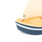 Small model boat close up on a white background