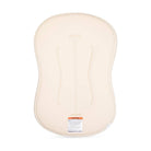 A beige baby support cushion or diaper support pad shown from the back, featuring molded ergonomic support channels and a small product label near the bottom edge, set against a plain white background.