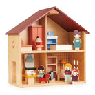 An open-faced wooden dollhouse by Mentari with a red roof and natural wood frame, arranged with miniature wooden furniture, a toy dog, and several wooden character figurines standing outside the rooms.