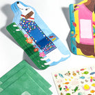 Colorful children's book with a dog illustration, green fabric, and sticker sheet on a white background
