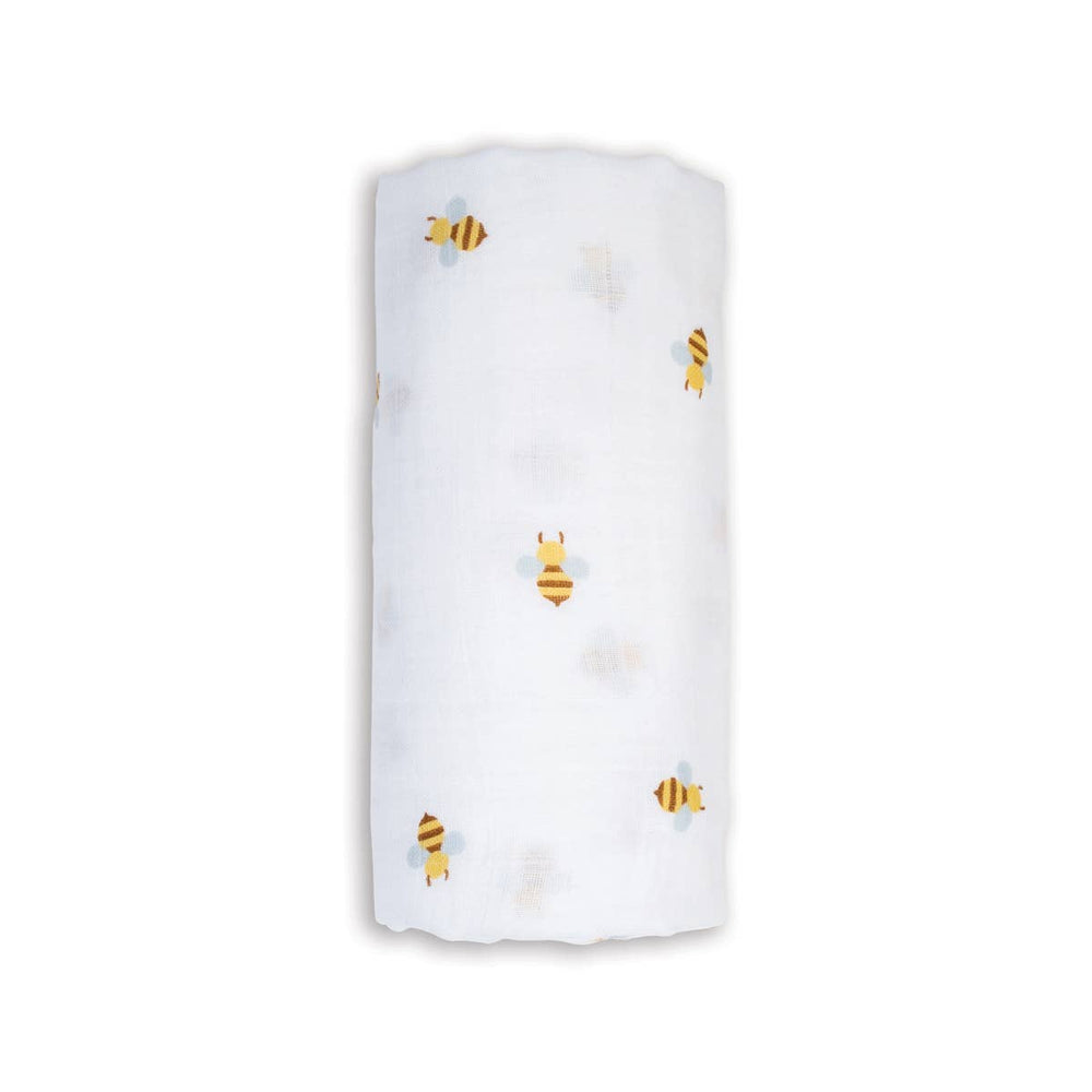 White towel with embroidered bee designs on a white background