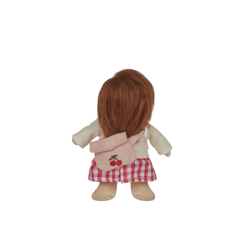 Stuffed toy with a pink backpack featuring cherry designs on a transparent background