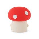 Mushroom-shaped toy with a red cap and white spots on a white background