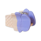 Purple ice cream cone-shaped cookie cutter on a white background