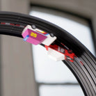 Close-up of a bicycle wheel with a gear system attached, blurred background