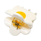 White cloud-shaped clip with a yellow center on a white background