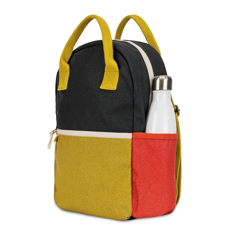Color-blocked backpack with a water bottle on a white background