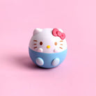 Hello Kitty-themed product with a pink bow on a pink background