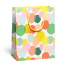 Gift bag with colorful balloon pattern on a white background