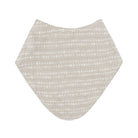 A triangular baby bib in a light beige fabric with a white dotted horizontal stripe pattern, shown flat against a white background.
