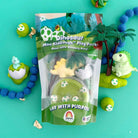 Dinosaur-themed mini kid dough play pack with toys on a teal background