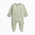 A baby long-sleeve footed sleeper in a light sage green and white stripe pattern, featuring a colorful striped inner collar and a small red tag on the leg.