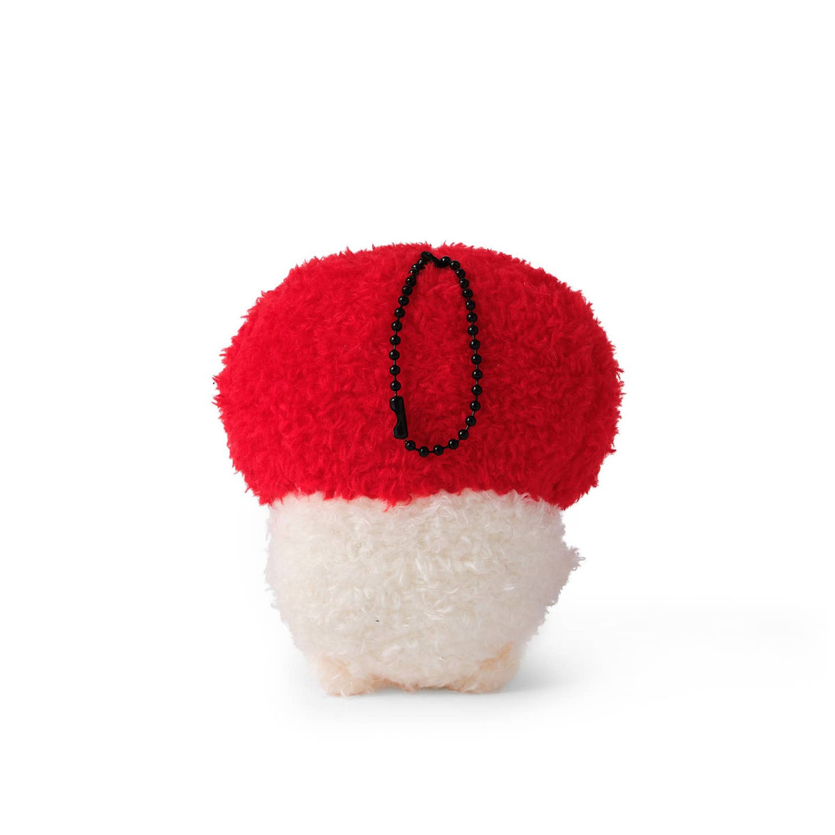Red and white mushroom plush toy on a white background