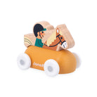 A wooden toy car with a horse-shaped rider, featuring a mustard yellow body, white wheels, and a natural wood horse topper. The brand name 'Janod' is printed on the side.