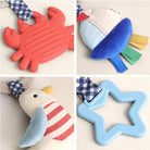 Collage of four children's toys including a red crab, blue star, and other items on a neutral background.
