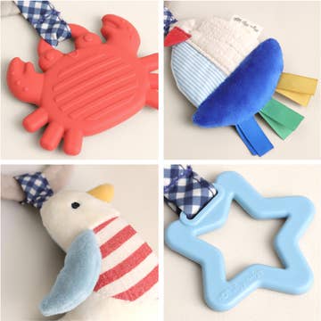 Collage of four children's toys including a red crab, blue star, and other items on a neutral background.