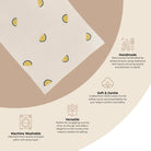 Product packaging with lemon pattern and text about product features on a beige background