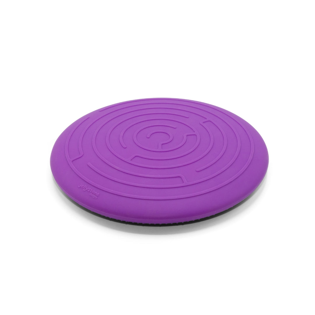 Purple balance disc on a white background