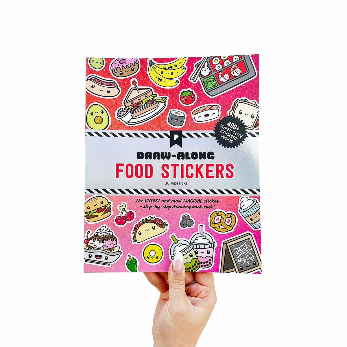 Book titled 'Draw-Along Food Stickers' held in a hand against a white background.