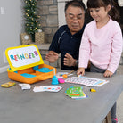 Man and young girl playing with educational toys at a table
