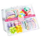 Set of colorful hair ties in a clear plastic container with 'Eggy Cakes' branding.