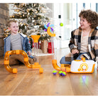 Two children playing with a colorful toy set on a wooden floor in a home setting.