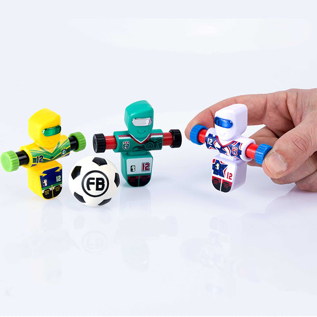 Three robot toys with a soccer ball on a white background