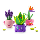 Colorful toy plant pots with faces on a white background