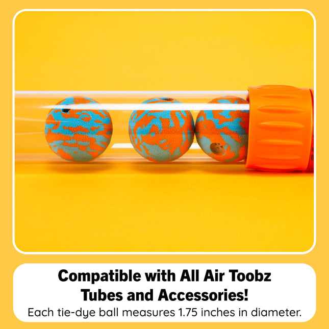 Three orange and blue tie-dye air pump balls inside a clear tube, with a bright orange cap, on a yellow background. Text below says it is compatible with all Air Toobz tubes and accessories, and each ball measures 1.