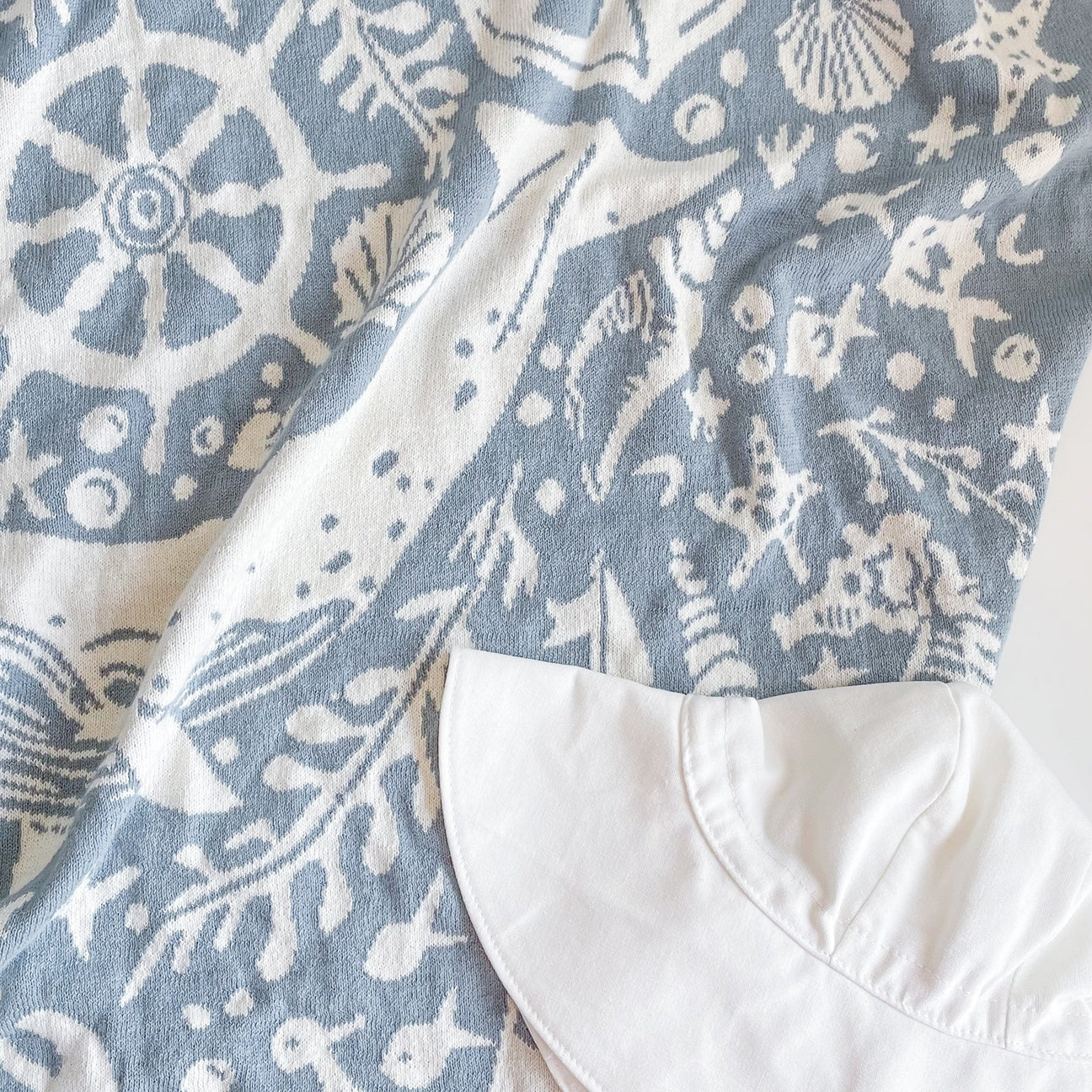 Blue and white patterned fabric with nautical designs