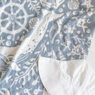 Blue and white patterned fabric with nautical designs
