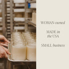 Person holding a tray of jars in a warehouse setting with text about a woman-owned, made-in-the-USA small business.