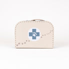 A beige faux-leather case designed like a vintage medicine box, featuring a blue cross with a paw print in the center and a trail of paw prints along the side, set against a plain white background.