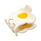 Silicone mold shaped like a fried egg on a white background