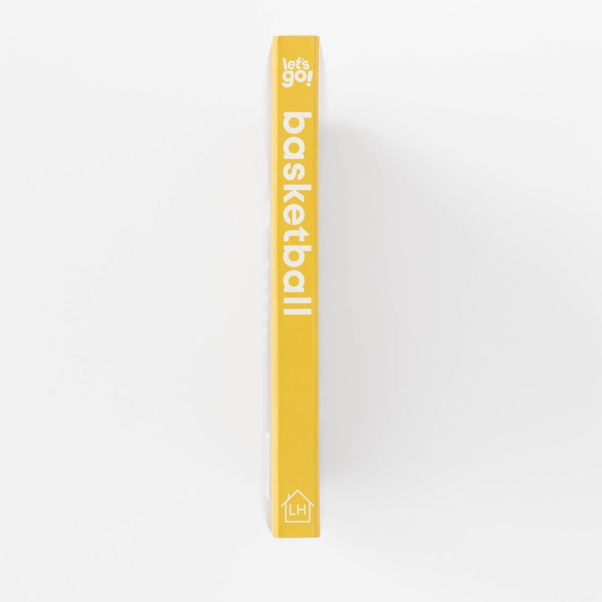 Yellow book titled 'basketball' on a white background