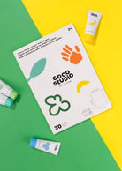 Coco Studio product packaging on a green and yellow background