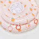 Baby seat with pink and white striped pattern and orange character design on a white background